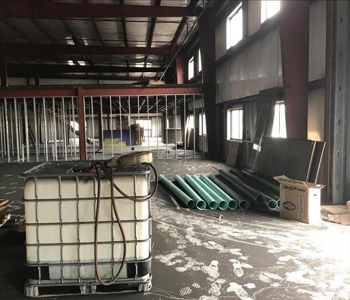 warehouse with black soot on the floor